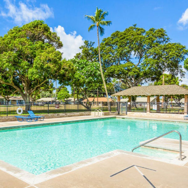 community pool with lounge chairs